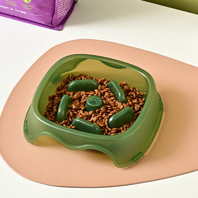 Blue plastic dog slow feeder bowl with anti-choking design on a white background.