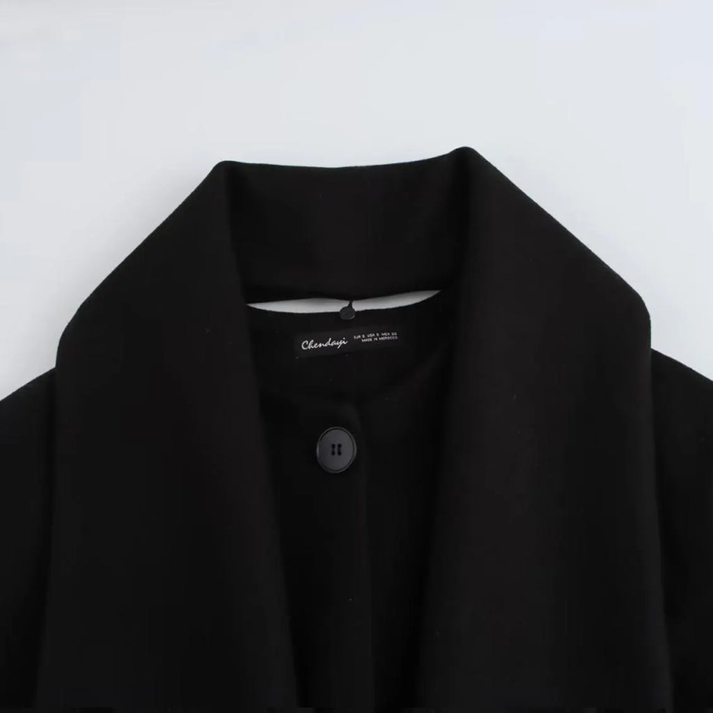 Women's longline street fashion coat with artificial fur collar in lengthened silhouette