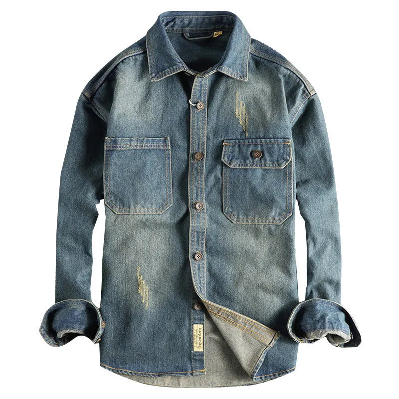 Man wearing a light blue loose-fit vintage denim shirt with long sleeves in a cardigan style.