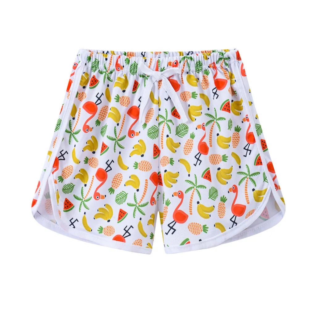 Children's polyester beach shorts in various colors and patterns including pineapple and kitten designs for sizes 100 to 140