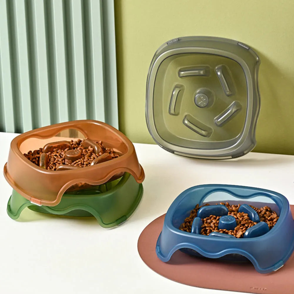 Blue plastic dog slow feeder bowl with anti-choking design on a white background.