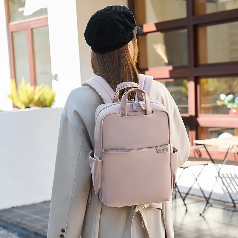 Women's canvas travel backpack in three sizes with multiple internal organisational compartments