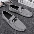 Men's black and grey suede casual shoes with a rubber sole.