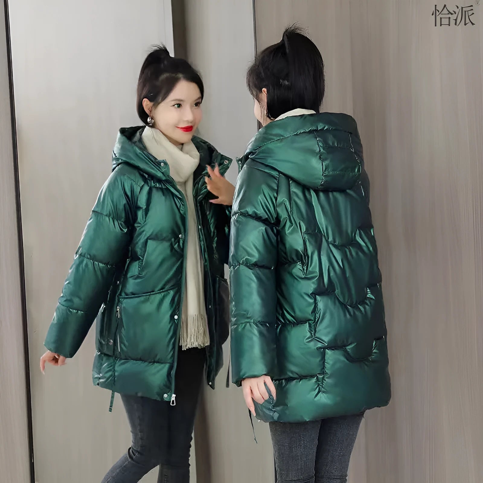 A woman's loose-fitting, thick, hooded winter jacket in a choice of colours on a size chart background.