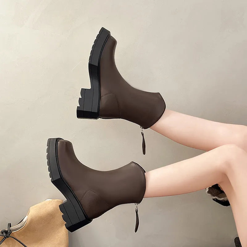 Black platform Martin boots for women with square toe and back zipper, shown on a white background.