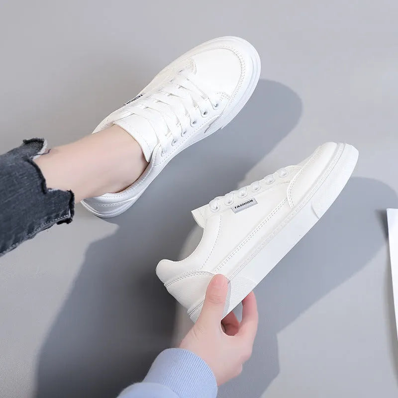 Korean style low-top women's sneakers in white and brown, showing artificial PU upper and plastic sole