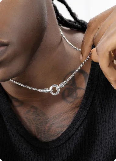 Delicate sterling silver clavicle necklace with pendant on a silver chain.