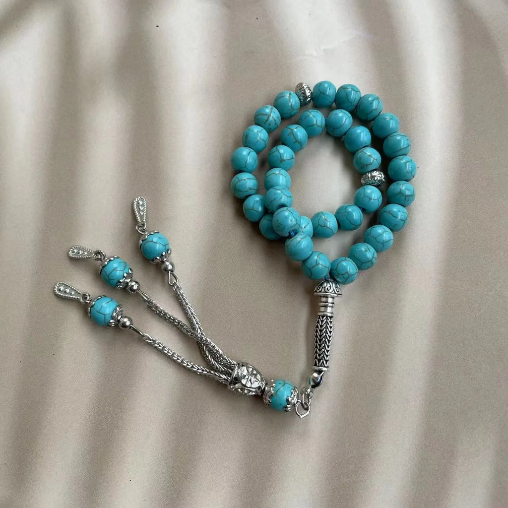 Sky blue stone Muslim dhikr bracelet with 8mm handmade beads on a wrist.