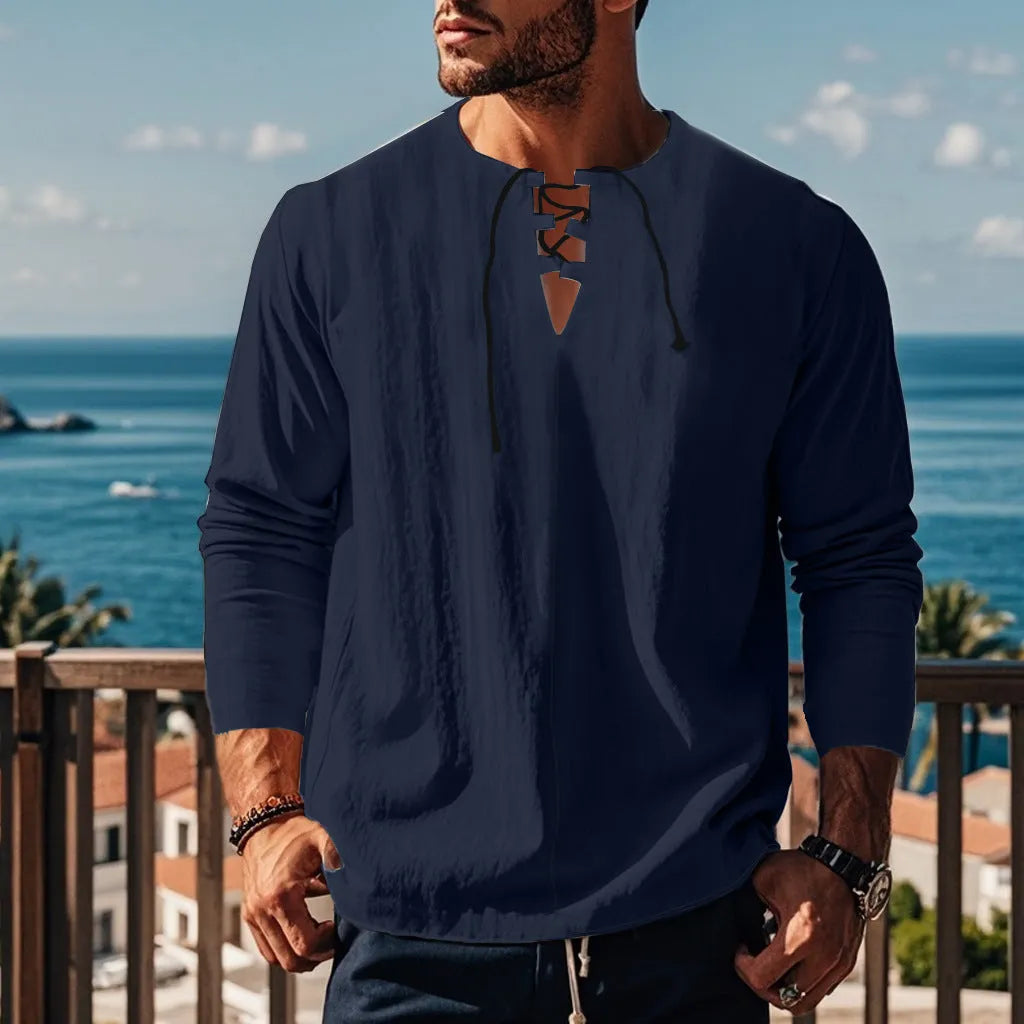 Cotton linen beach ruff shirt in a loose pullover style on a hanger.