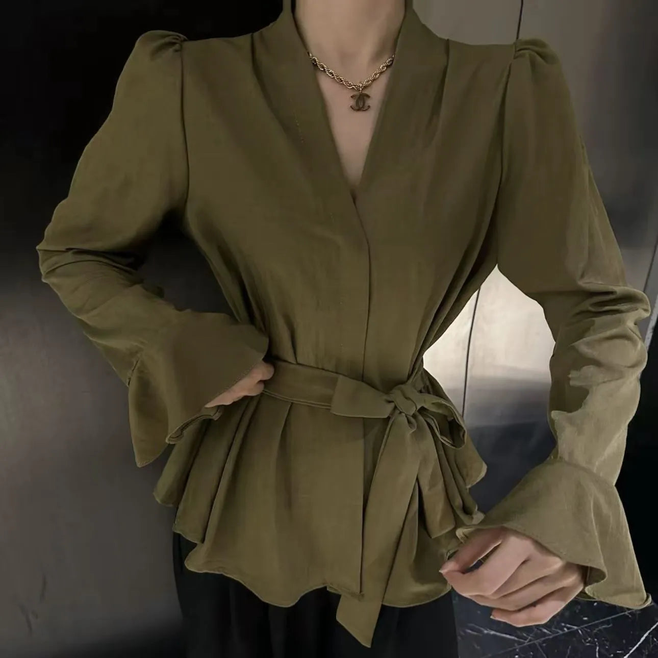 Women's French-style black shirt with irregular collar and long bell sleeves