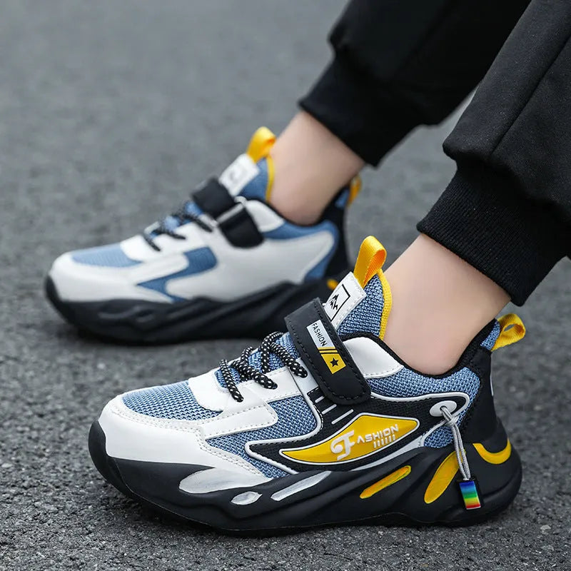 Boys' blue and black Velcro fastening sports shoes with a textured non-slip sole.