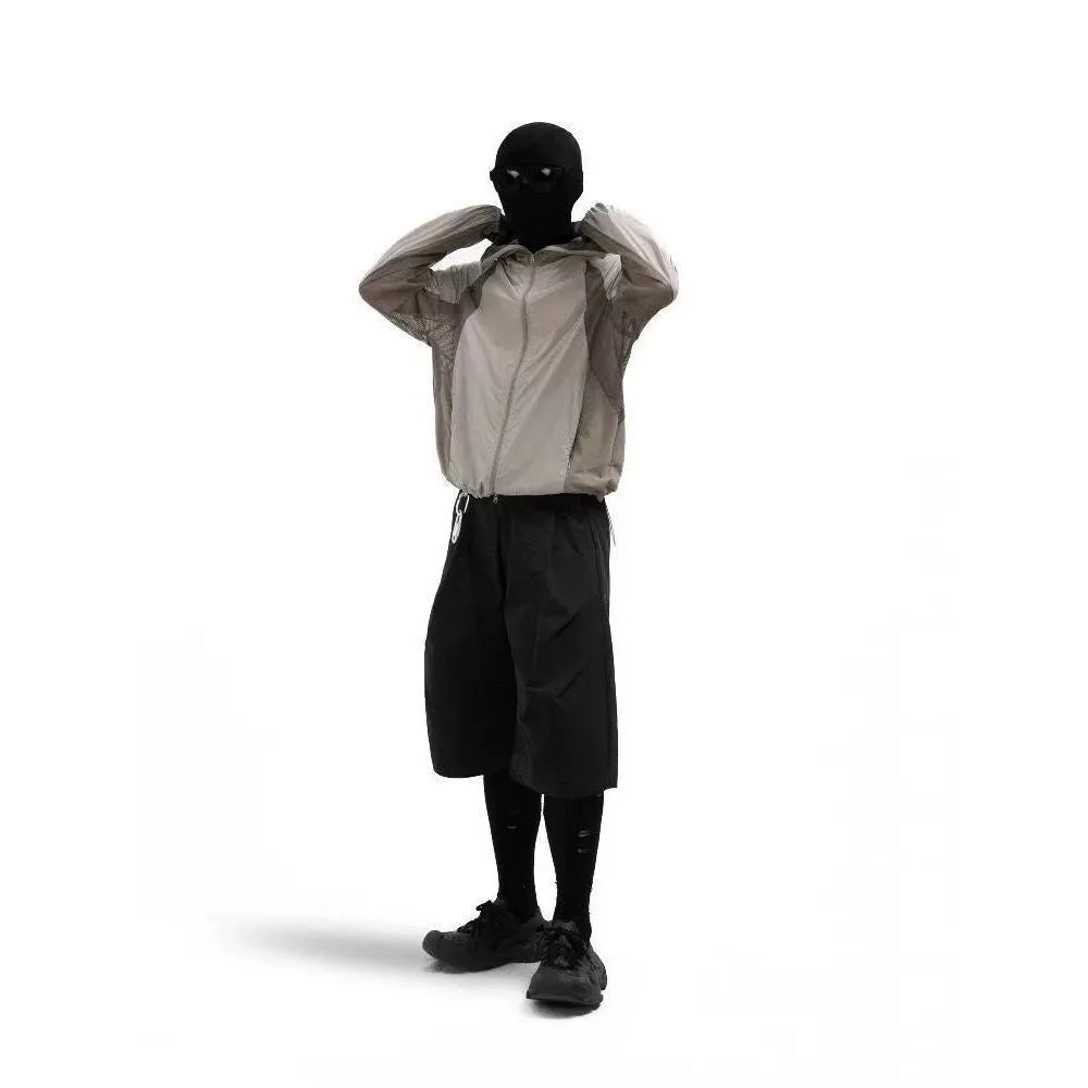 Mesh stitching sun protective nylon top shown in desert brown colour on a hanger.