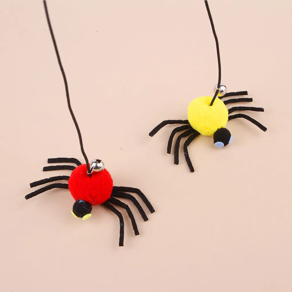Red cat hanging door toy with elastic rope, feather, bell, and spider decoration
