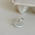 Geometric open ring with interlaced matte metal pattern in gold or silver electroplated finish