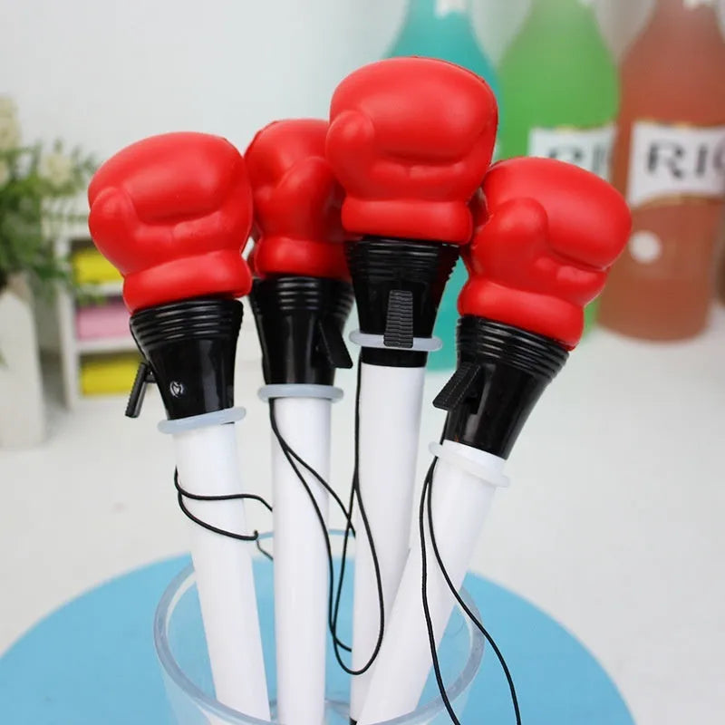 Set of four black and silver boxing press ejection pens with 0.7mm bullet tips displayed on a white surface.