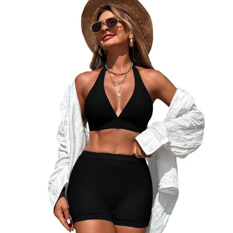 Women's split bikini swimsuit in black, pink, blue, or purple with sleeveless design for swimming