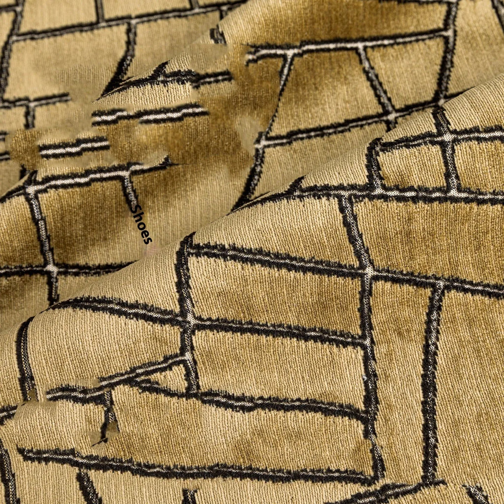 Local gold geometric abstract pattern on a square polyester cushion cover.
