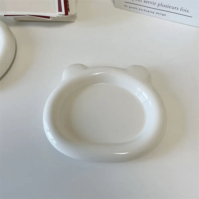 White ceramic plate with bear doodle design, 20cm diameter, on a table.