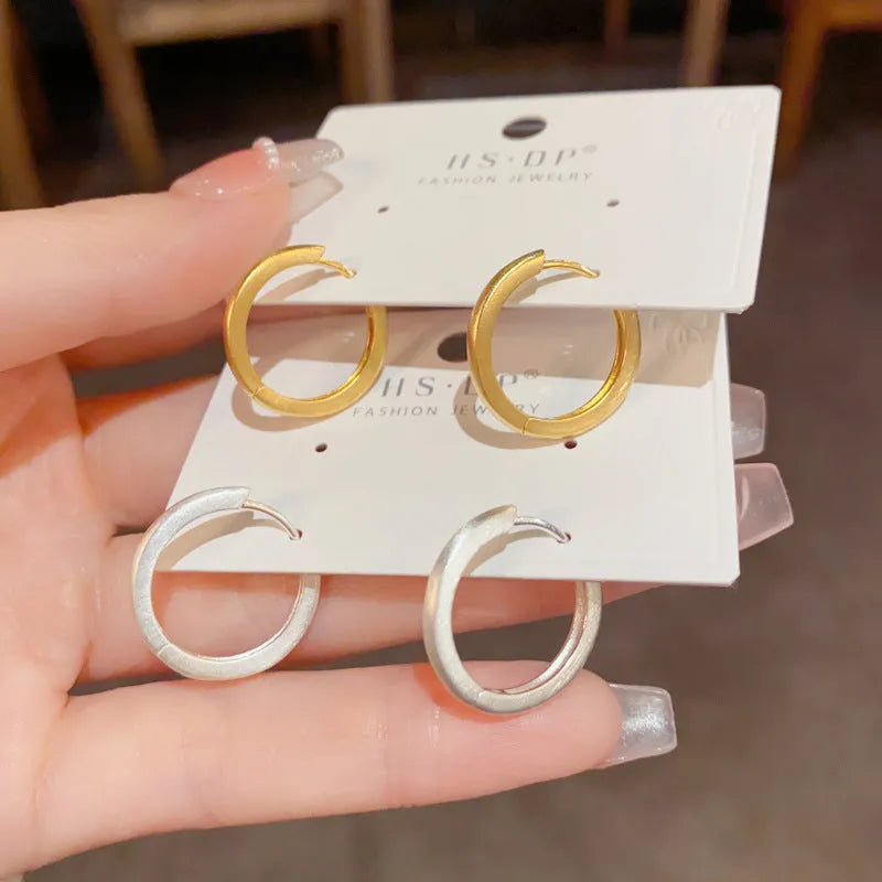 Geometric circle ear clip in gold finish with real gold plating on copper material
