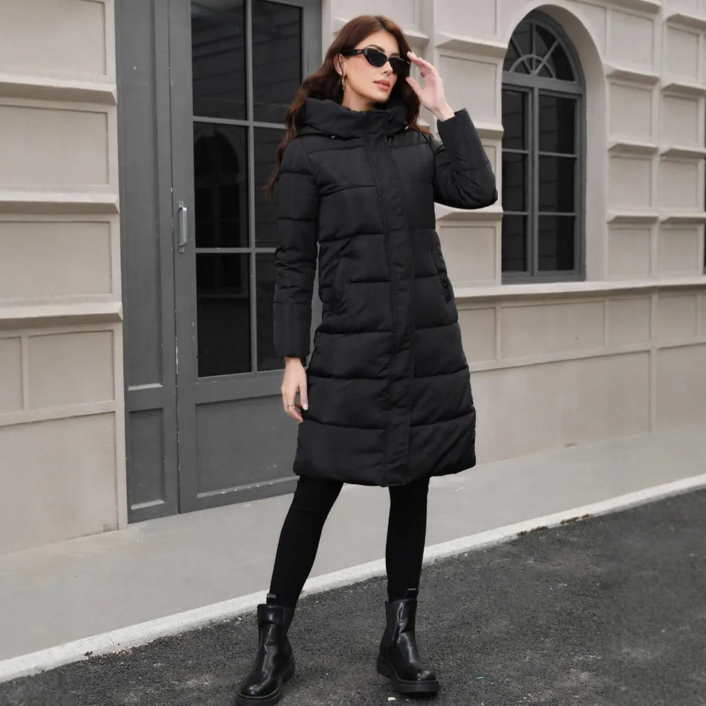 Black hooded long cotton jacket for men with a slim fit design on a model.