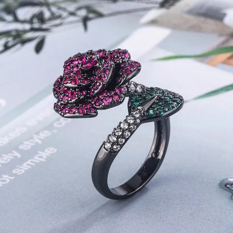 Women's black gold geometric ring with gold-plated red corundum flower detail