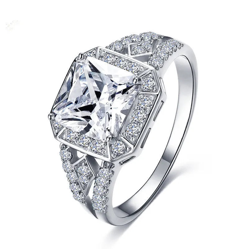 Platinum colour geometric zircon ring with hollow quadrilateral design on finger