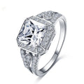 Platinum colour geometric zircon ring with hollow quadrilateral design on finger