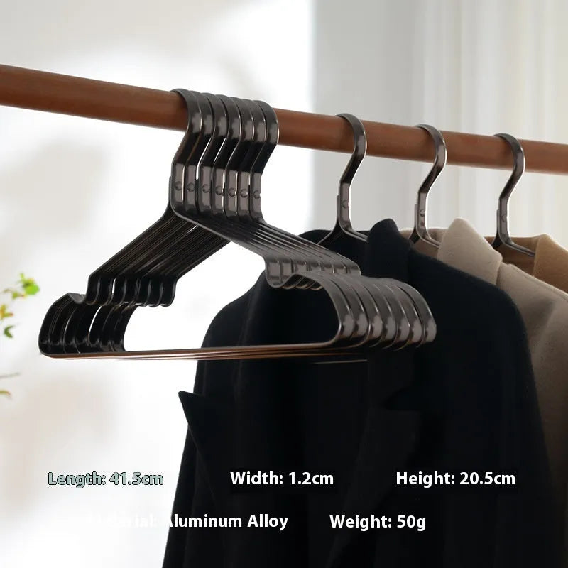 A single elegant black non-slip clothes hanger on a white background.