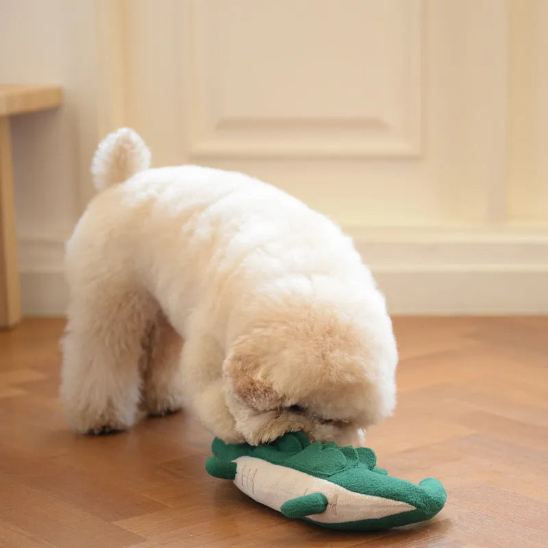 Green plush toy dog stuffed animal on a white background.