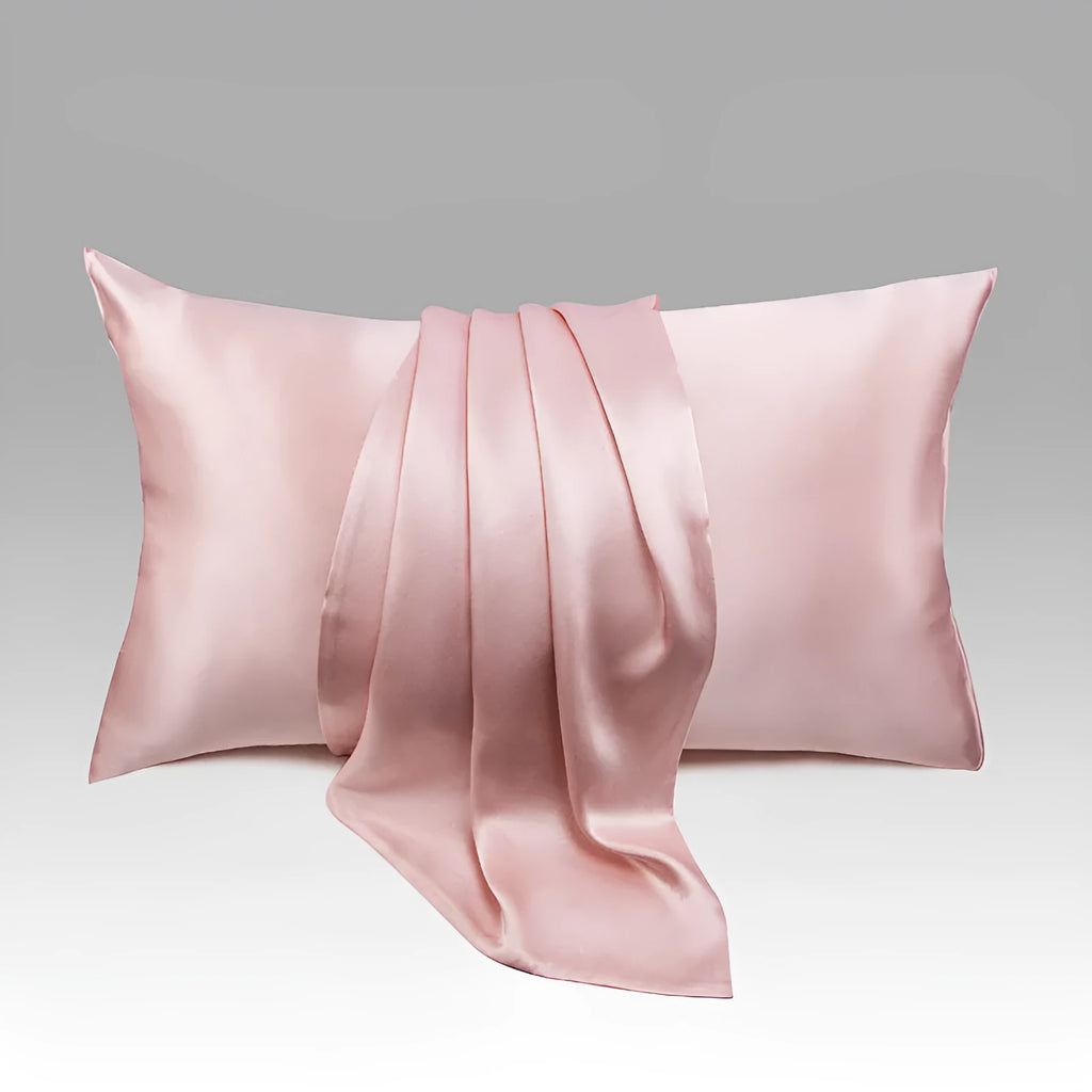 Solid colour mulberry silk envelope pillowcase in dark grey on a bed