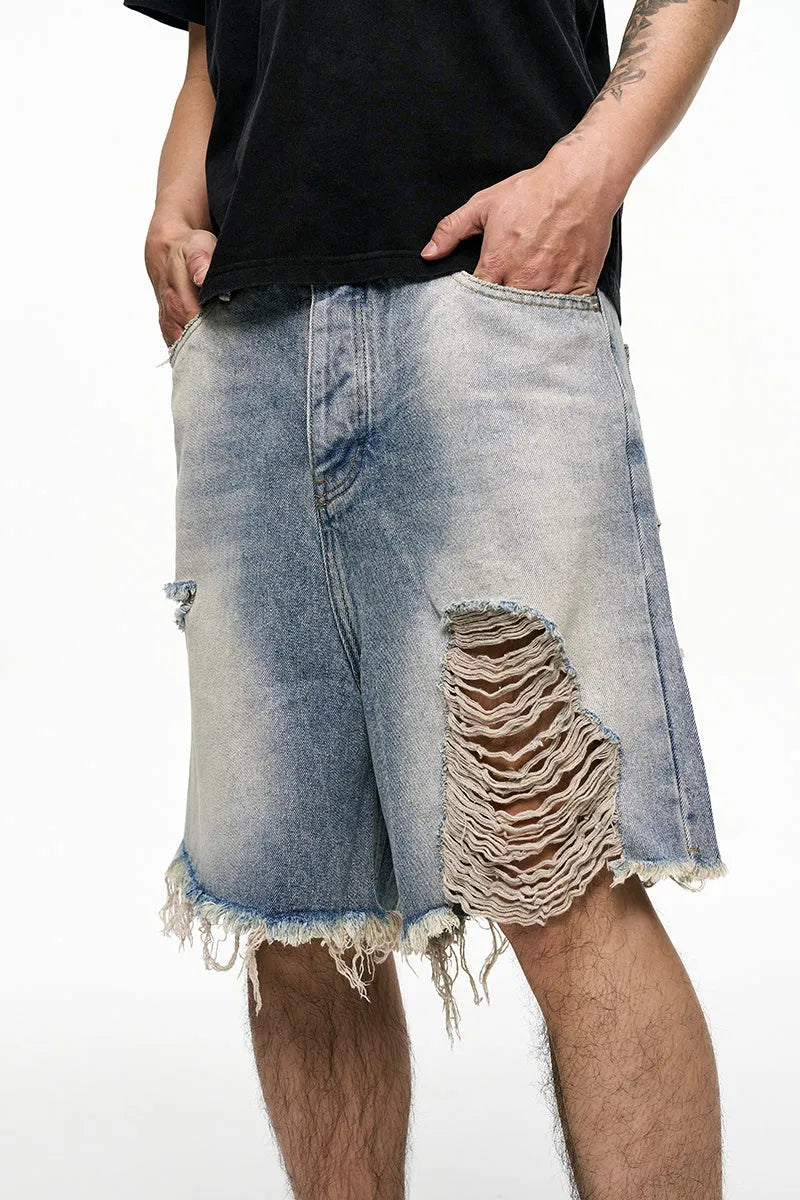 Men's light blue denim shorts with baggy wide leg cut and retro washed finish