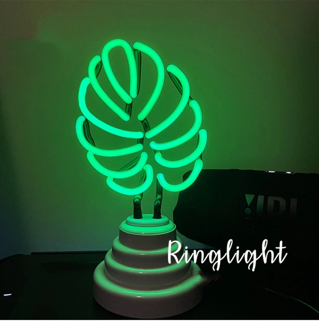 White tube bamboo shape desktop lamp emitting green light with USB cable