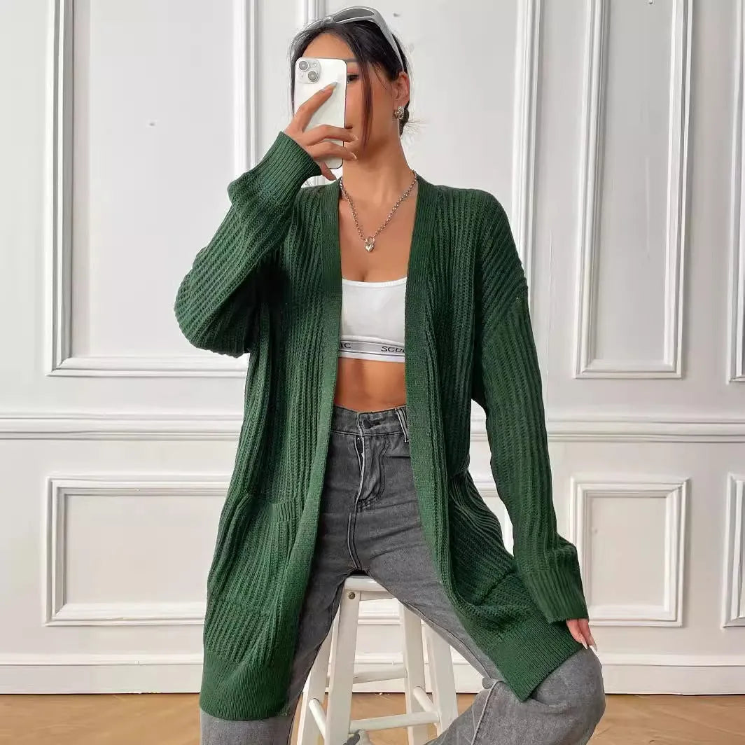 Loose fit women's acrylic cardigan sweater with double pockets in solid color
