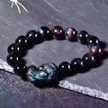 Natural ice colour obsidian crystal bracelet with spherical beads on wrist