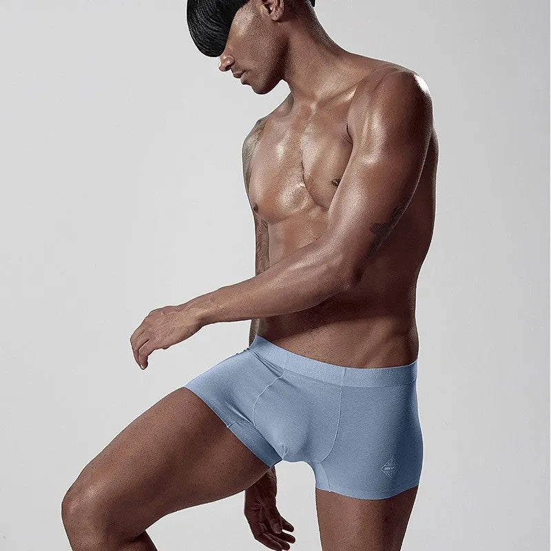 Seamless modal men's underwear brief in green colour showing mid-waist fit