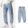 Men's loose-fit tapered cotton trousers in black, blue and grey colours
