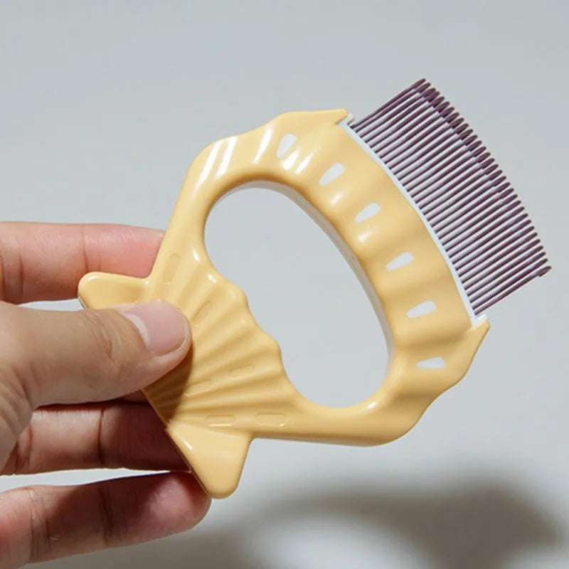 Green shell-shaped pet grooming brush with fine bent wire bristles and an anti-slip handle.