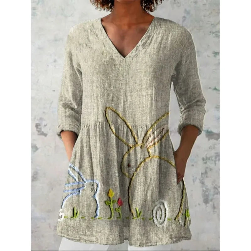 Women's floral printed loose dress with wide waist and three-quarter sleeves on a hanger.