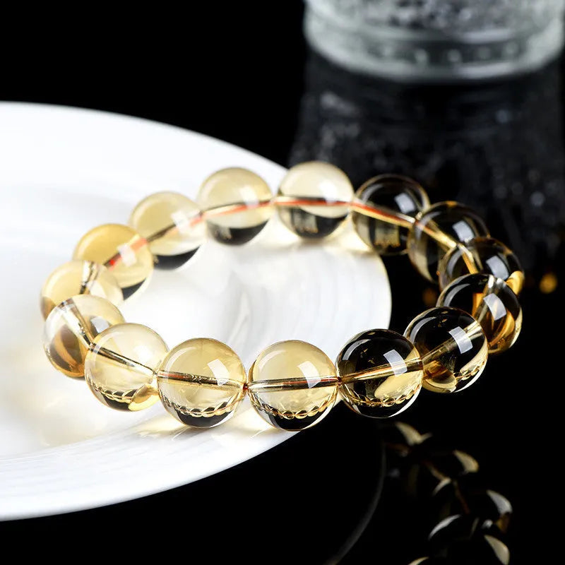 Natural citrine scattered beads ball bracelet showing polished stones in a 7A or 6A grade colour on a wrist.