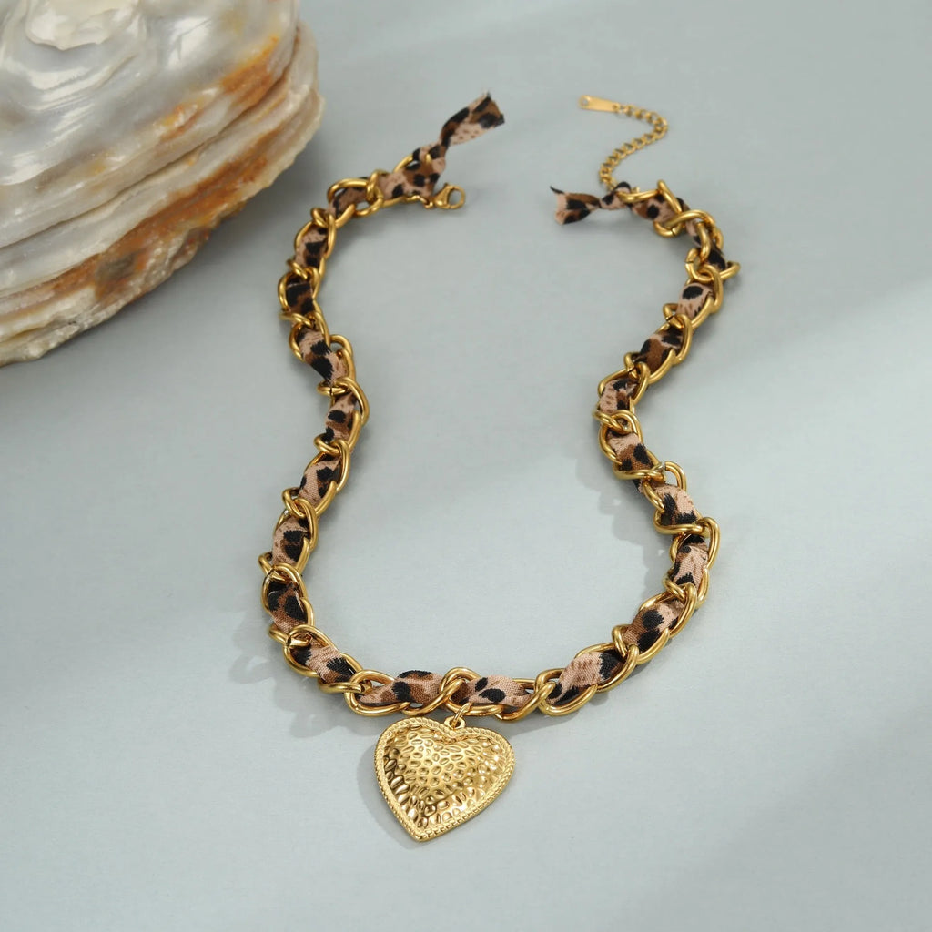 Stainless steel geometric leopard love pendant necklace with electroplated 18K finish on adjustable chain
