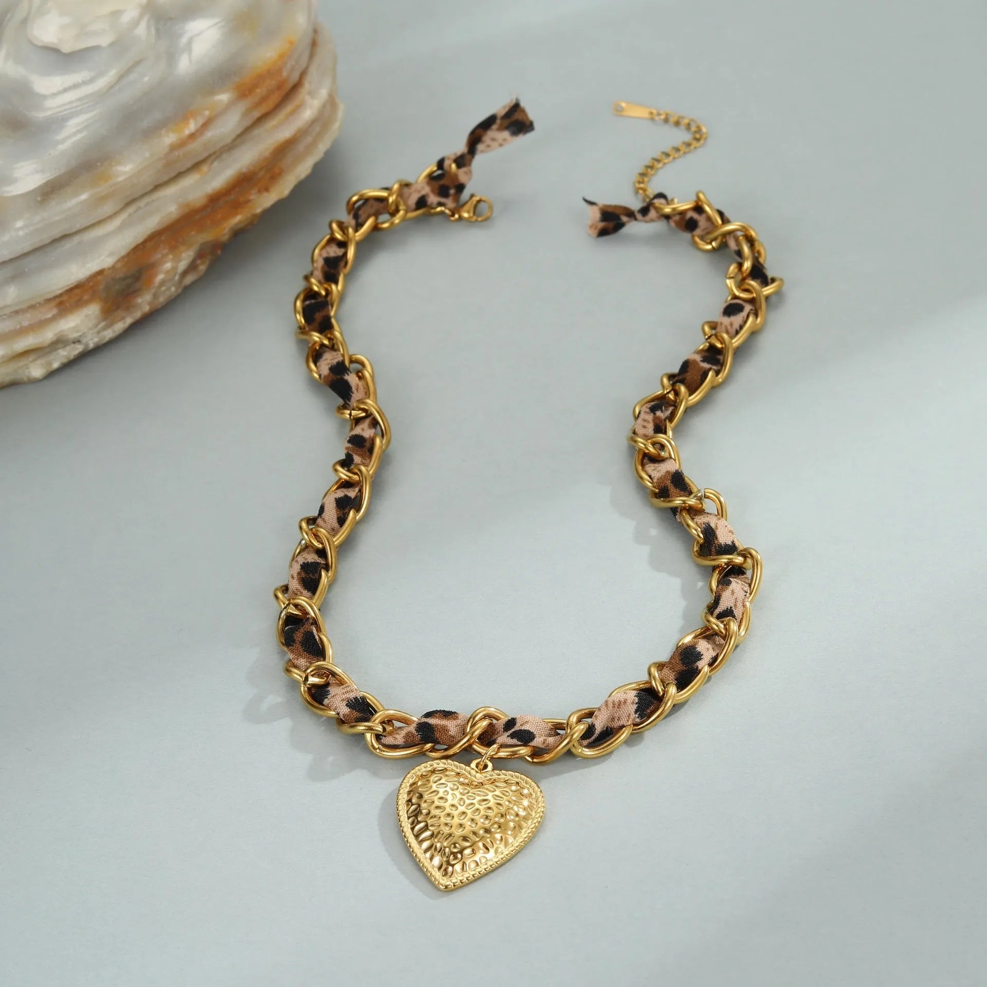 Stainless steel geometric leopard love pendant necklace with electroplated 18K finish on adjustable chain