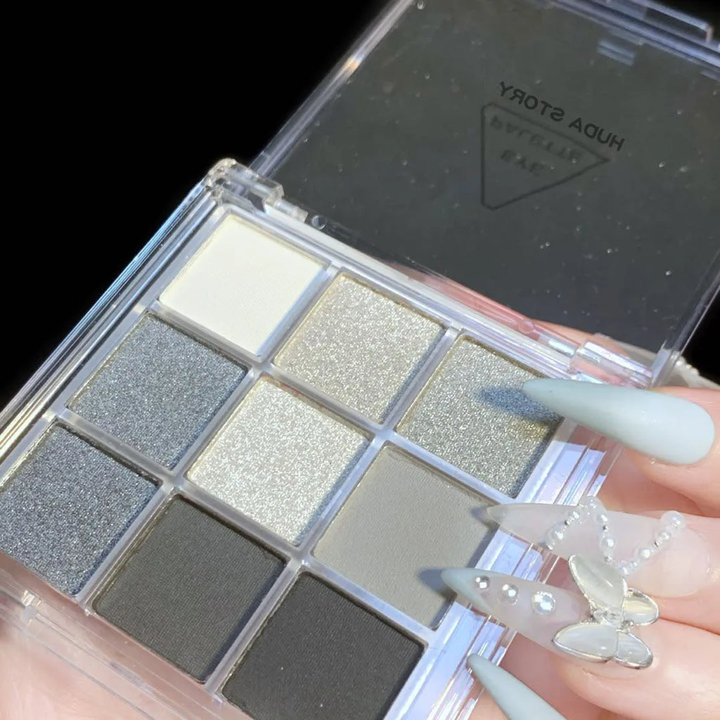 Smoked design nine-colour eyeshadow palette showing white, silver, black, and iron grey shades