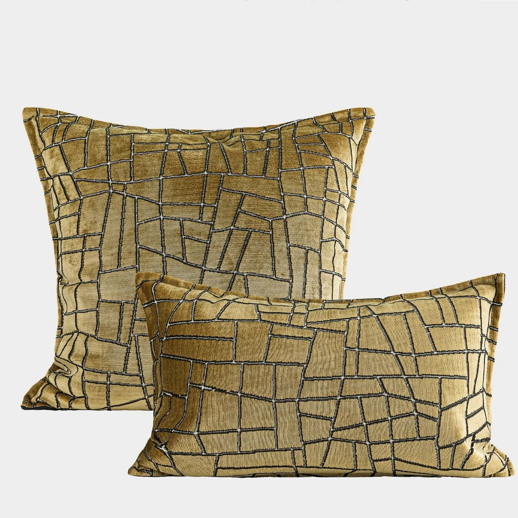 Local gold geometric abstract pattern on a square polyester cushion cover.