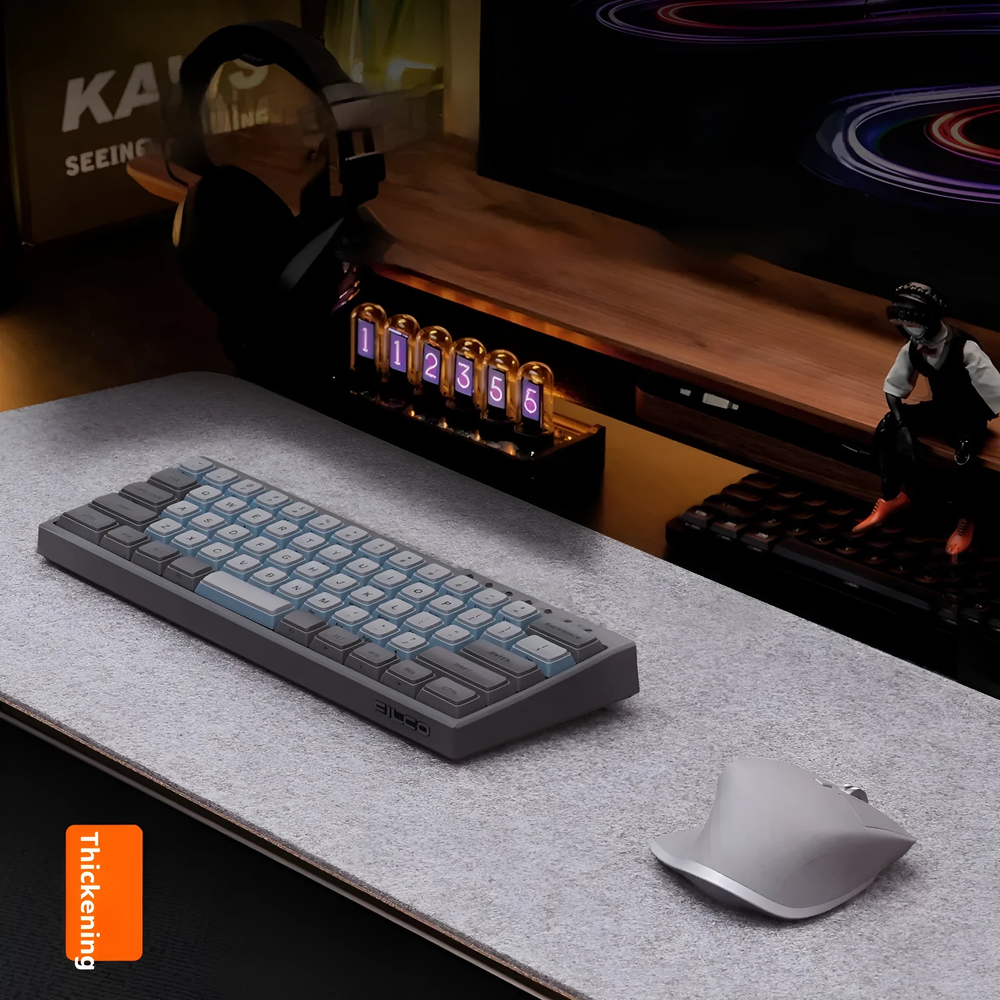 Oversized felt cork desk mouse mat in black and grey pattern, shown on a wooden desk.