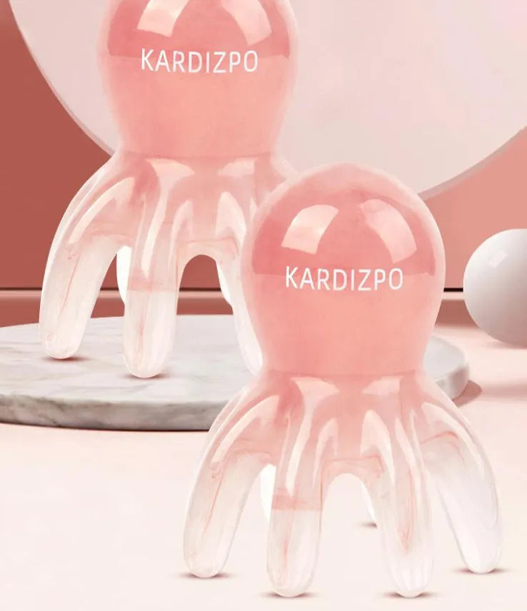 Pink octopus-shaped periocular meridian massage comb made from natural resin with storage bag
