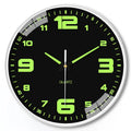 Modern round luminous wall clock 20cm diameter with plastic case on a wall