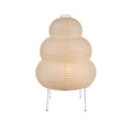 Japanese style rice paper table lamp with handmade shade on aluminium base showing three-tone dimming button