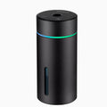Black aluminium portable car air humidifier and essential oil diffuser unit with USB cable.
