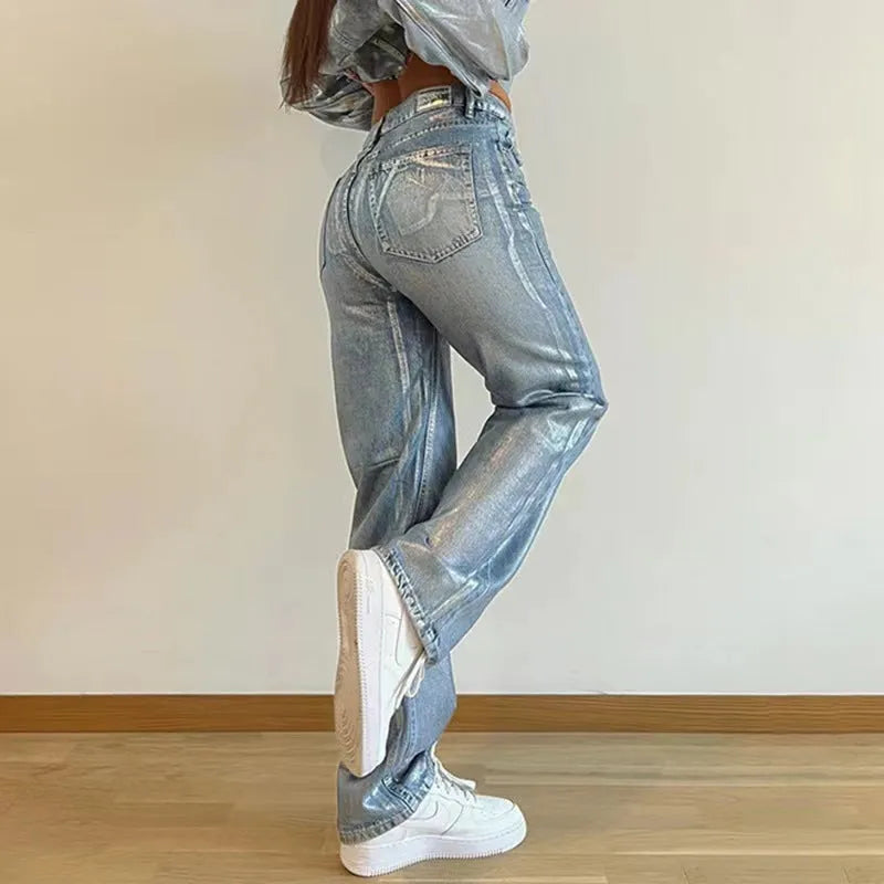 Women's blue high waist straight leg jeans with silver contrast detailing on denim fabric
