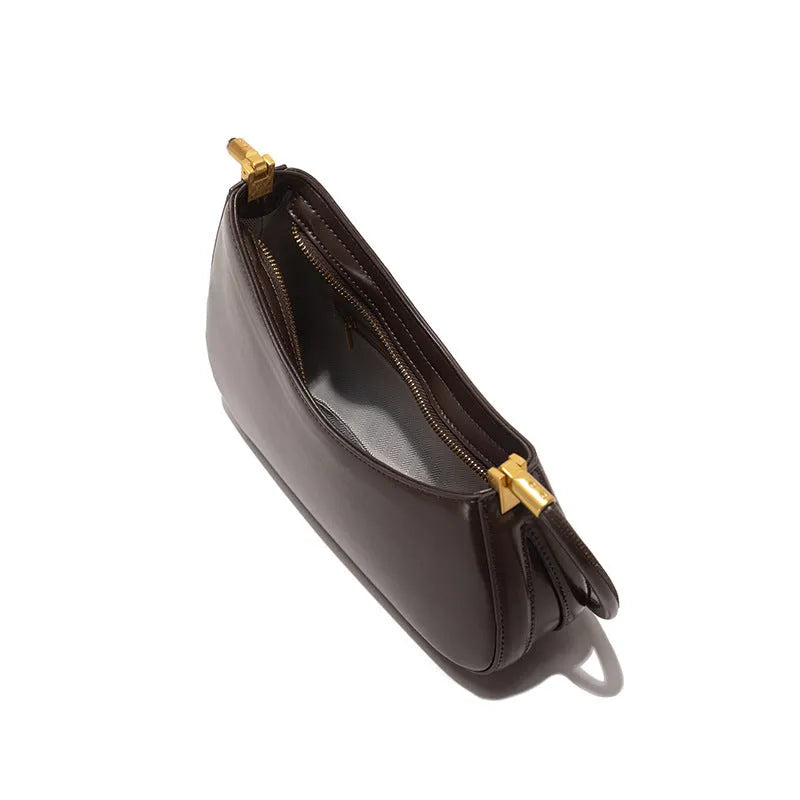 Structured oval women's underarm bag in PU leather with a single strap, shown in a colour option.